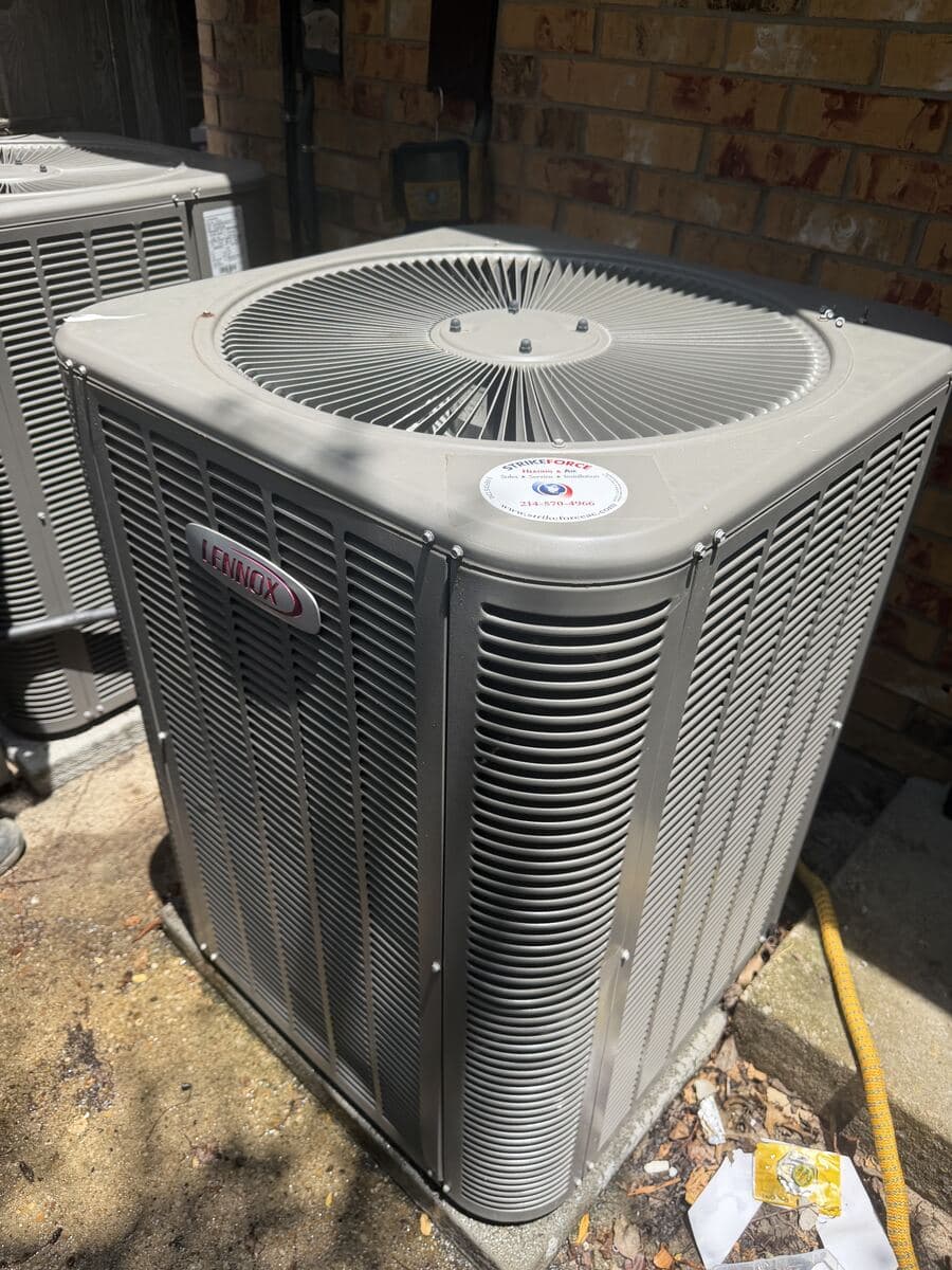Lennox condenser with the Strike Force service sticker applied after a maintenance visit